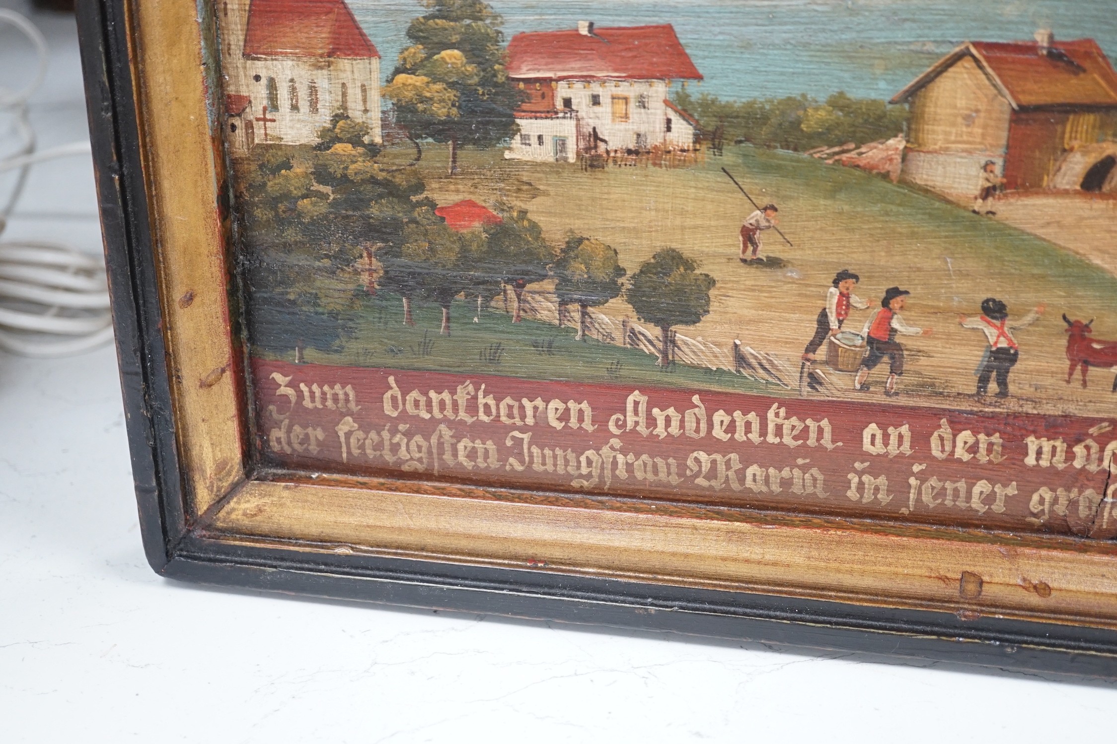 19th century German School, oil on wooden panel, Village scene with figures fire fighting, inscribed and dated 1855, 30 x 47cm